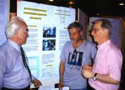E. M. Kolesnikov (left), A. Shukolyukov (centre) and G. Longo (right) at the poster presentation of the paper at the Asteroids 2001 Conference